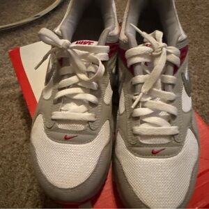 Nike Gray and White Sneakers with Red Highlights